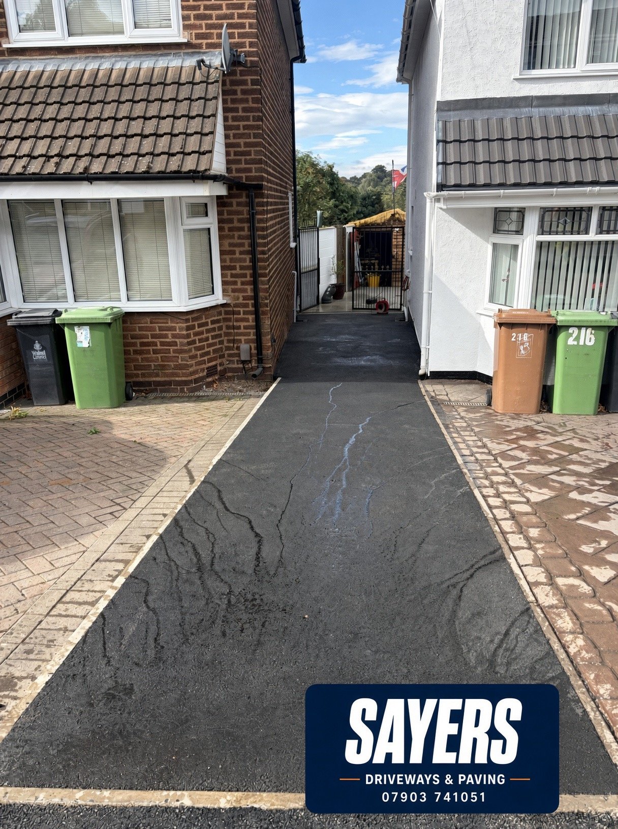 Completed tarmac driveway pathway between two properties